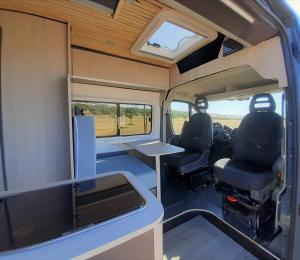 an inside view of an rv with a table and chairs at The Feather Van in Puerto del Rosario
