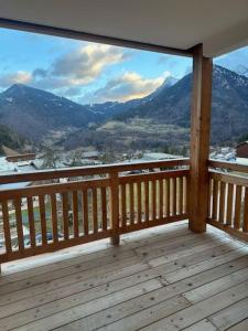 a balcony with a view of the mountains at L'Eden Roc in Saint-Jean-d'Aulps