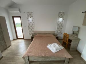 Postel nebo postele na pokoji v ubytování Vila Leul