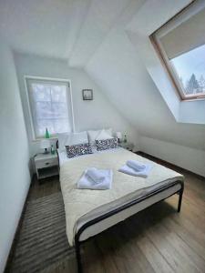 Кровать или кровати в номере Domek w Skrudzinie