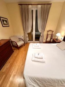 Cama o camas de una habitación en Acogedor alojamiento en Martinet, Cerdanya.