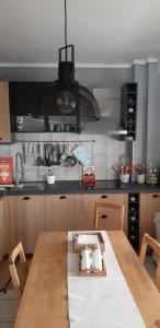 Кухня или мини-кухня в Cosy Home Boutique Apartment
