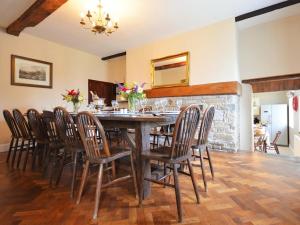 a dining room with a table and chairs at 9 Bed in Hay-on-Wye 73069 in Painscastle