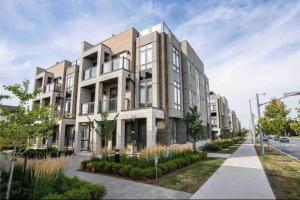 a rendering of a large apartment building on a street at Luxe Toronto Townhome, Rooftop Terrace, Parking in Toronto