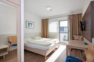 Rúm í herbergi á Hotel Kolping Wien Zentral