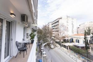an apartment balcony with a view of a street at King George 32 Luxury Apartment in Thessaloniki