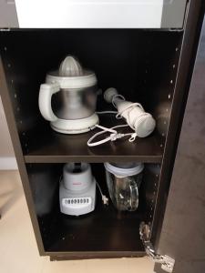Příslušenství pro přípravu čaje a kávy v ubytování Appartement Cartier 2