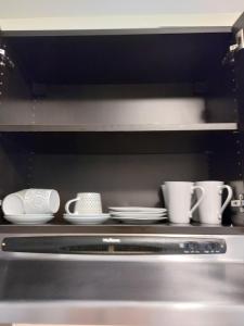 Příslušenství pro přípravu čaje a kávy v ubytování Appartement Cartier 2