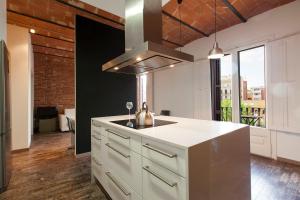 Kuchyň nebo kuchyňský kout v ubytování AB Paral·lel Spacious Apartments