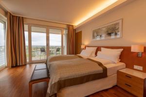Postel nebo postele na pokoji v ubytování ATLANTIC Hotel Wilhelmshaven