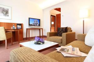 TV a/nebo společenská místnost v ubytování ATLANTIC Hotel Wilhelmshaven