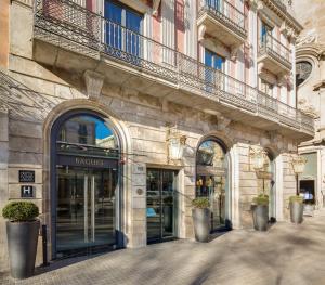 a building with an entrance to a store at Hotel Bagués, a Small Luxury Hotel of the World in Barcelona
