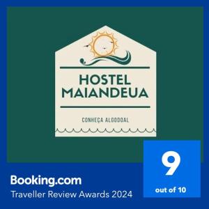a sign for a hotel malmandevula with a logo at HOSTEL MAIANDEUA in Algodoal