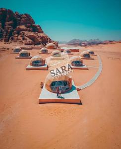 a group of tents in the desert at SARA LUXURY RUM CAMp in Wadi Rum