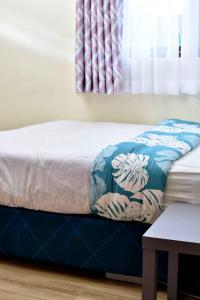 Säng eller sängar i ett rum på Kandiz Exquisite