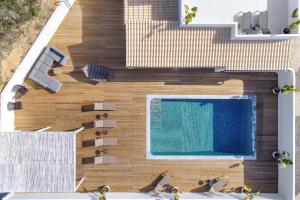 an overhead view of a swimming pool on a wooden deck at Casa Felicidade in Carvoeiro