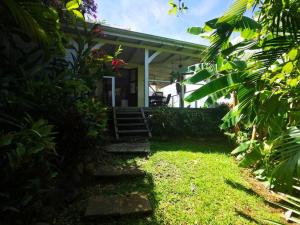 Vrt pred nastanitvijo Bungalow vue mer avec jardin
