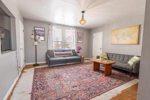 a living room with a couch and a table at New Listing!! Bright Bohemian Stay in Laramie
