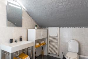 a bathroom with a sink and a toilet and a shower at Casa das Eiras, Nº48 in Santana