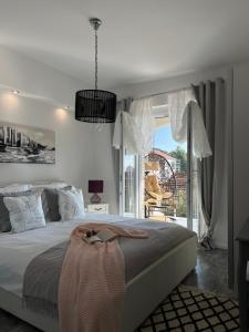 Ένα ή περισσότερα κρεβάτια σε δωμάτιο στο DiVine Luxury Apartment