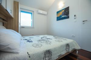 Postel nebo postele na pokoji v ubytování Apartments Seafront