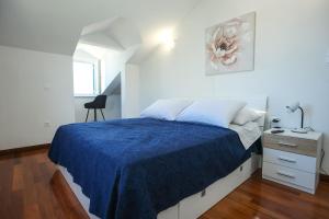 Postel nebo postele na pokoji v ubytování Apartments Seafront