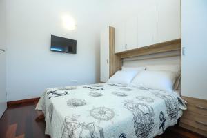 Postel nebo postele na pokoji v ubytování Apartments Seafront