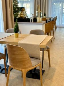 a dining room with a table and chairs at Hotel Antoni in Tomaszów Lubelski