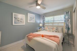 a bedroom with a bed and a window at Turtle Tracks East in Sanibel