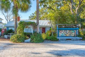 a house with a painting on the front of it at Creekside Paradise in Tybee Island