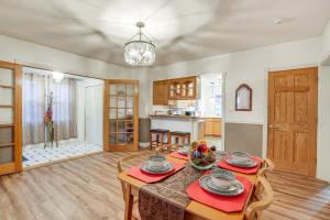 a kitchen and dining room with a table and chairs at Pet-Friendly Syracuse Home with Private Yard! in Syracuse