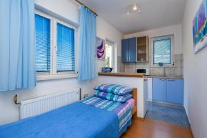 Posteľ alebo postele v izbe v ubytovaní Apartment Suhor