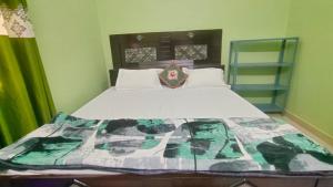 Llit o llits en una habitació de Prakash Homestay