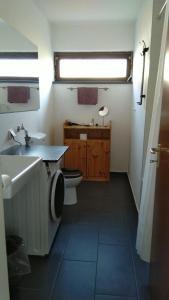 a bathroom with a toilet and a sink at Zimmer mit Aussicht in Schulenberg im Oberharz