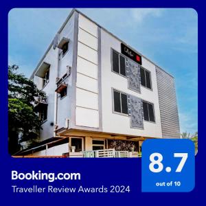a building under construction with the words travel review awards on it at Super Collection O Hotel Bhinna Sakala in Bhubaneshwar