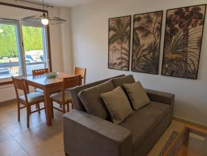 a living room with a couch and a table at Don Manuel Cuntis in Cuntis