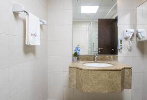 a bathroom with a sink and a mirror at ZAPBED House - AWP 1501 in Dubai