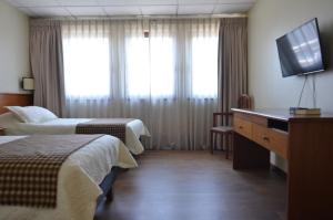Letto o letti in una camera di Tur Hotel Santiago