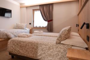 Postel nebo postele na pokoji v ubytování Chalet al Tabià