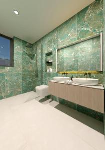 a bathroom with two sinks and a toilet at Villa Avis by IstriaLux in Modrušani