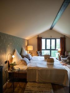 a bedroom with a large bed and a large window at Chalet Alte Schmiede in Göstling an der Ybbs