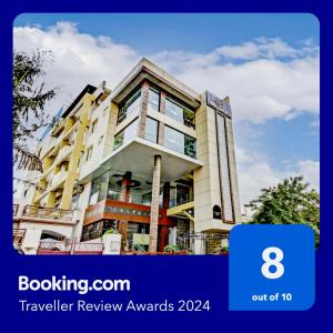 a building with the words travel review awards on it at Townhouse OAK Hind Palace Near Gomti Riverfront Park in Vibhuti Khand