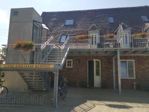a brick building with stairs and a apartment at Seenlandoase Reppist in Senftenberg +37 photos