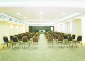 a room with a row of chairs and a stage at Tropical Barra Hotel in Rio de Janeiro +44 photos
