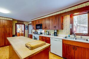 a kitchen with wooden cabinets and a counter top at Kenlo Farm 