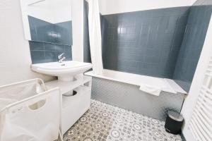 a bathroom with a sink and a toilet and a shower at #L8 Le Montorge City center Studio Fully equipped in Grenoble
