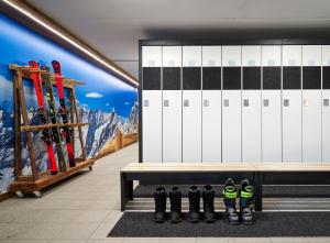 a room with skis and a bench in a building at Cervino - VRetreats in Breuil-Cervinia