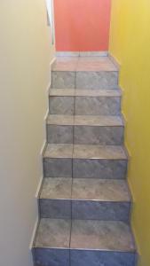 a set of stairs in a room at Sendero Patagonico in Las Grutas