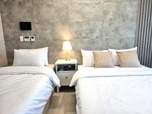 Postel nebo postele na pokoji v ubytování 라비앙즈-Raviens-Elliy's Room