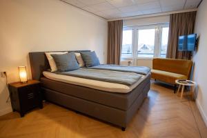 Postel nebo postele na pokoji v ubytování Hotel Workum